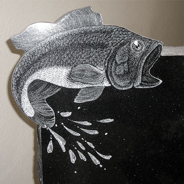 fish etched on tombstone memorial