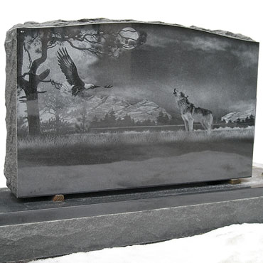 Wolf eagle wilderness etched on headstone memorial