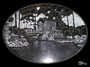 Gristmill water wheel stream etched on oval granite