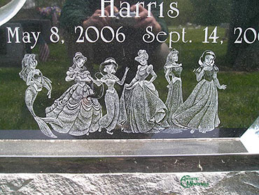 Disney Princesses etched on granite headstone