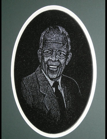 Portrait of man etched on granite oval