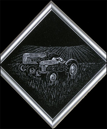 Ford and Cockshutt tractors etched on diamond shaped granite