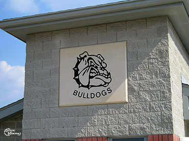 Bulldog mascot building stone in side of school